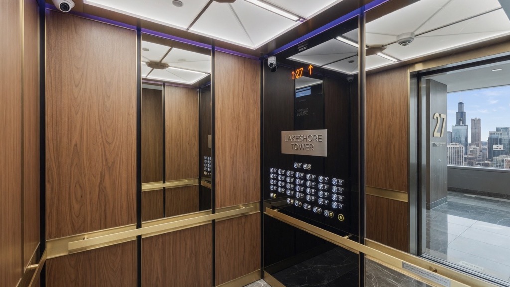 Modernized elevator interior with new cab and controls in a Chicago building